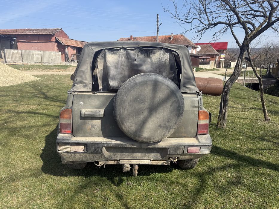 Atv 320 adly nr negre și Suzuki Vitara 1.6 i