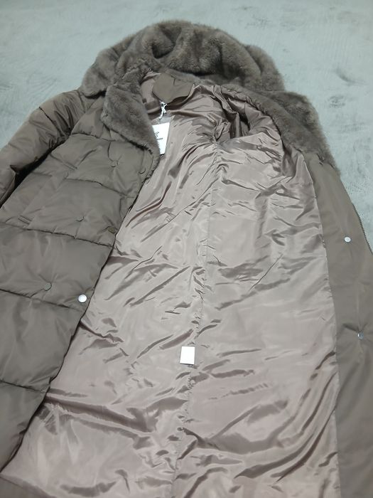 Продам пуховик новый