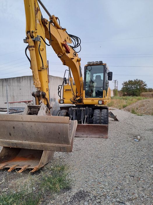 Vand cauciucuri 1000/20+ excavator Komatsu pw140 pe roti