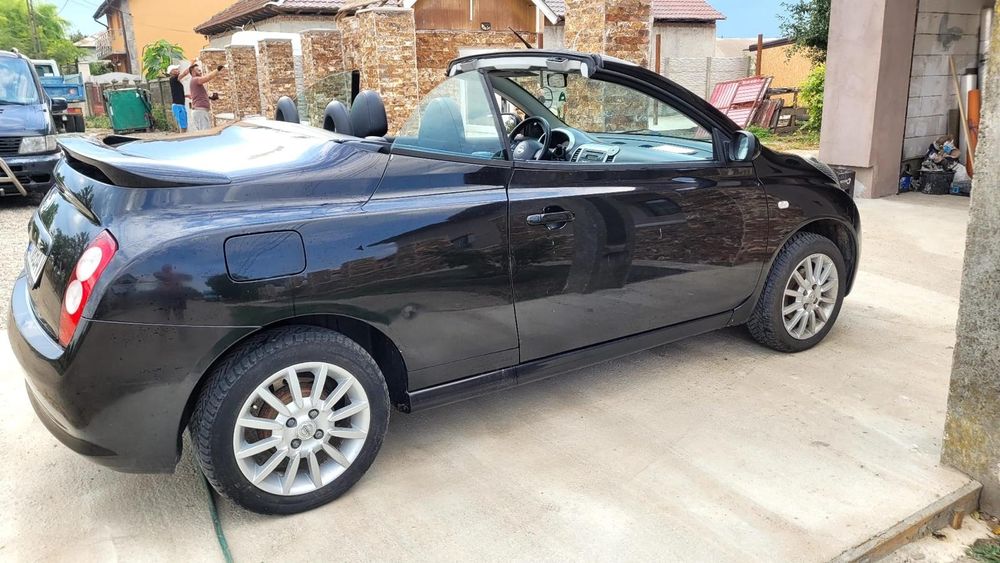 Nissan Micra 1,6 benzina decapotabil,  impecabil  Accept schimb cu  autoturisme s-au cu oi.