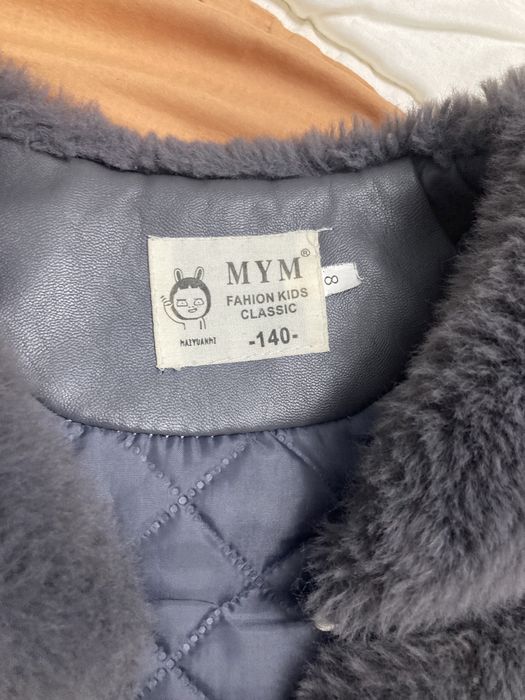 Меховая жилетка