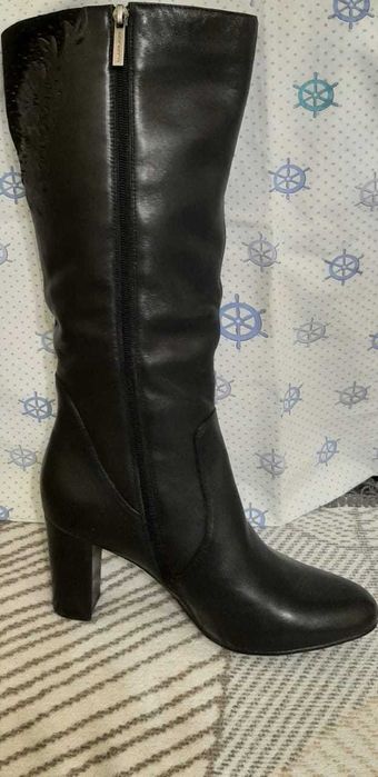 Продам новые сапоги