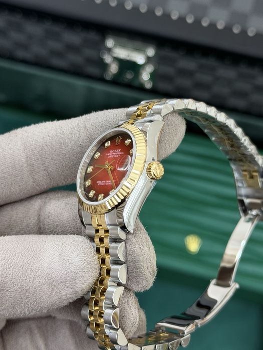 Rolex Datejust 31 Yellow Rolesor – Red Diamond Dial Jubilee