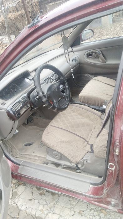 Машина Mazda кронс