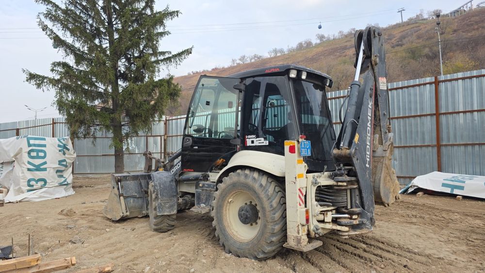 Услуги экскаватора-погрузчика