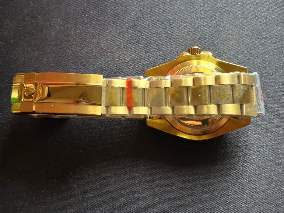 Rolex  Submariner, Day-Date Gold