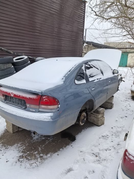 Мазда Кронос, капот, двери.