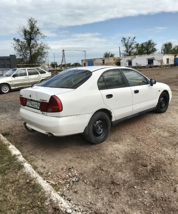 Митсубиси каризма 1999год