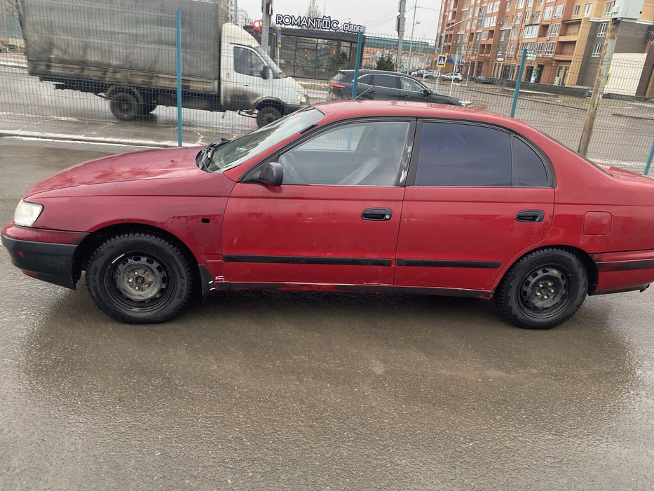 Тойота Carina e