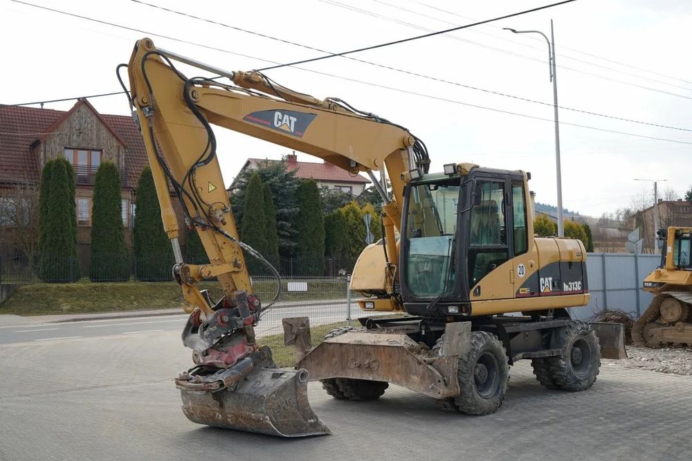 Cat M313C / EXCAVATOR PE ROȚI / CU ÎNCLINARE PIVOTANTĂ