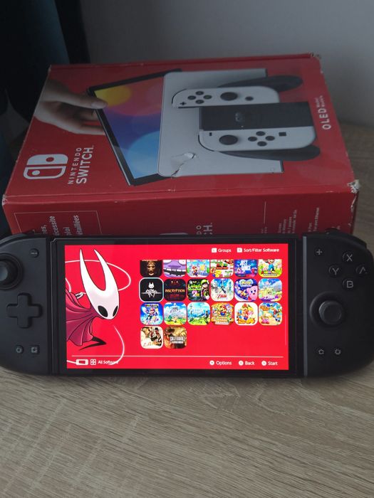 Nintendo Switch OLED Modat 512 gb + 74 Jocuri + Mobapad M6 HD – Stare excelentă