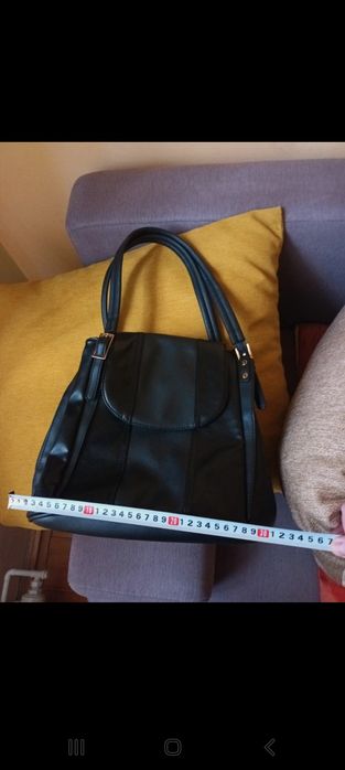 Vand geanta neagra de piele