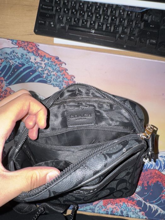 Барсетка бренда Coach