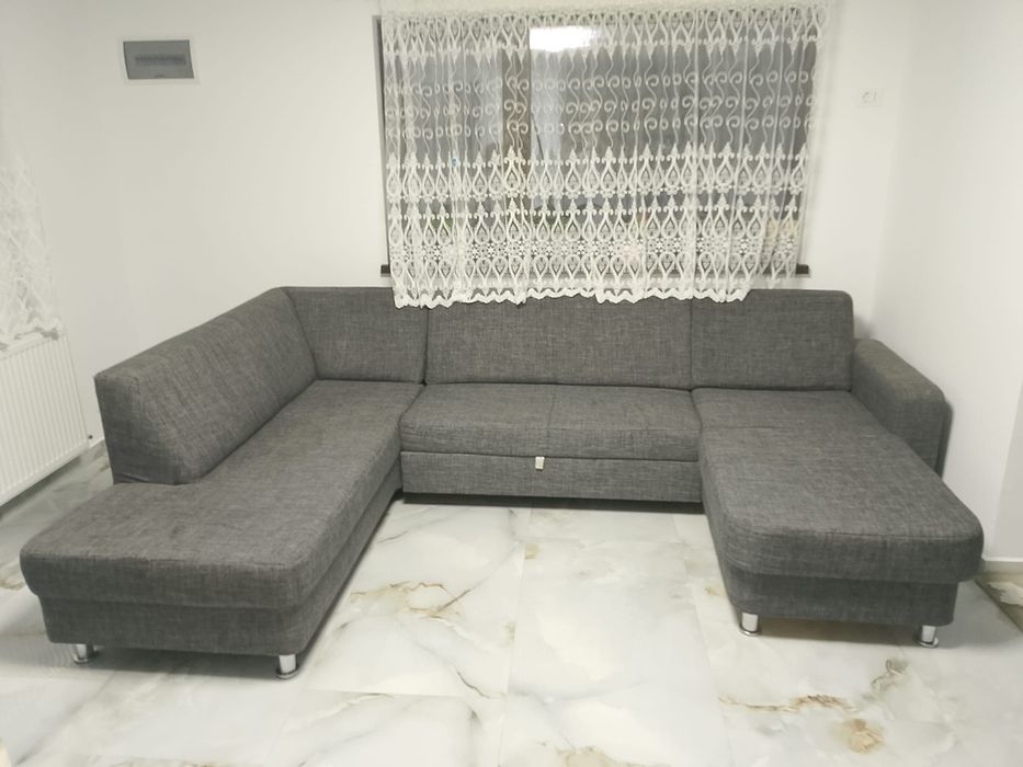 Vând colțar extensibil în forma U textil  gri. Saltea relaxa, stare foarte bună