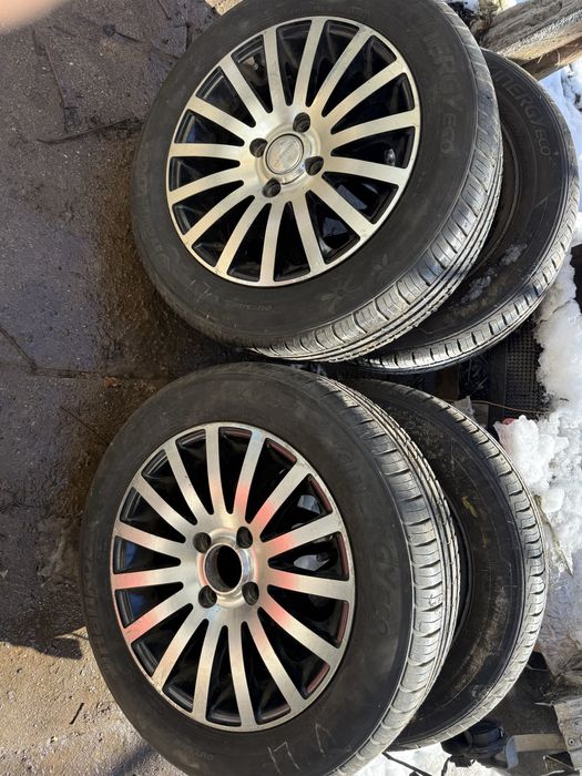 Продавам комплект 4-броя алуминиеви джанти с гуми-14 цола