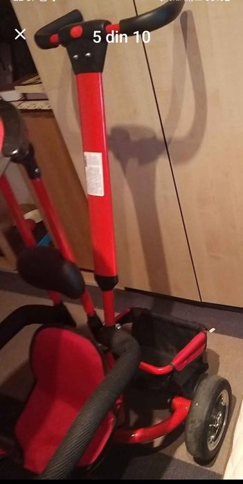 Vând bicicleta cu pedale,  copertină și mâner de ghidare