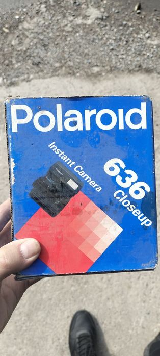 Полороид фотоаппарат.