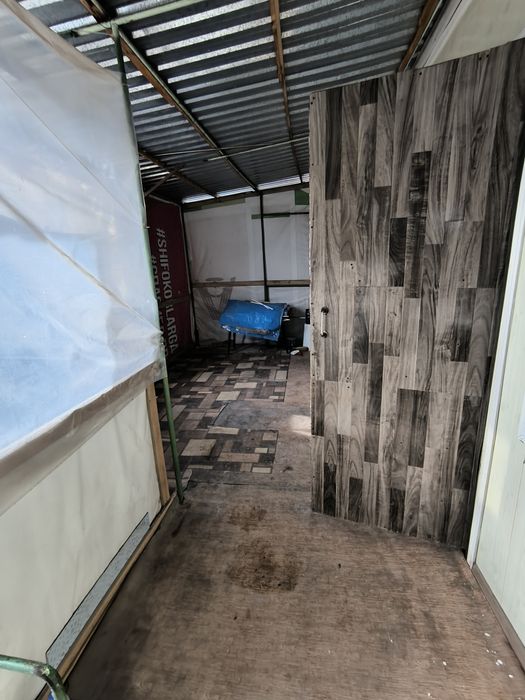 2 комнатную квартиру. 1/2 в деревянном доме.' выход в город въезд авто