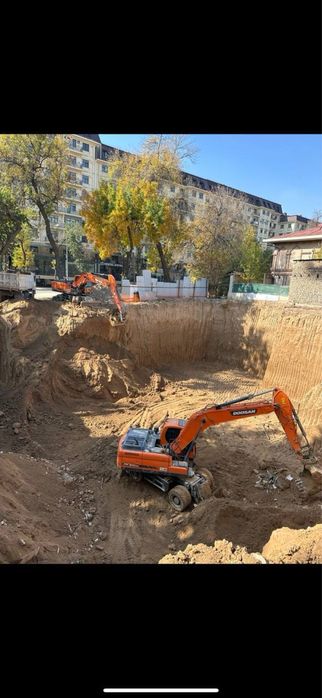 Экскаватор хизмати