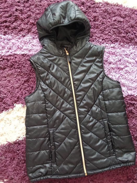 Vestă damă ca nouă.
