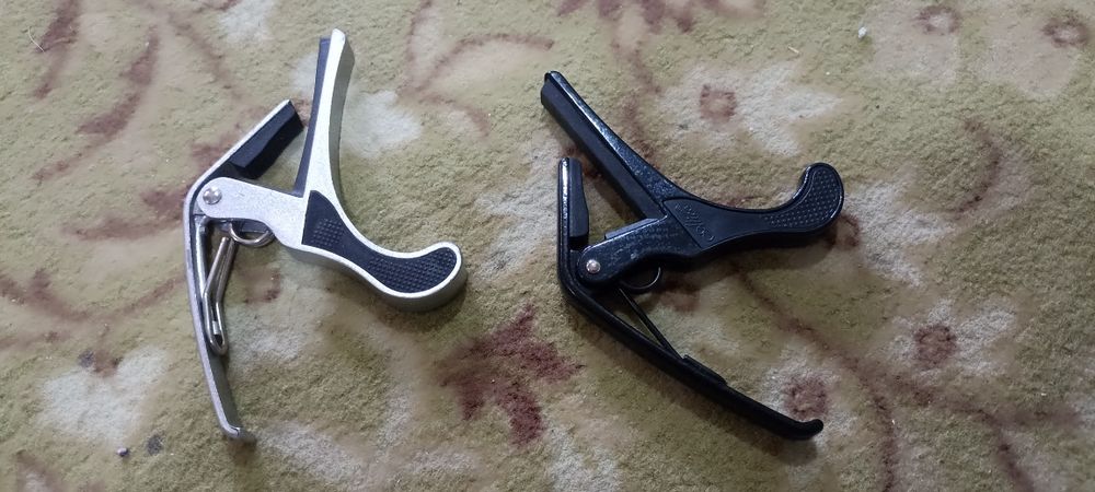 Каподастры и ремни для гитары