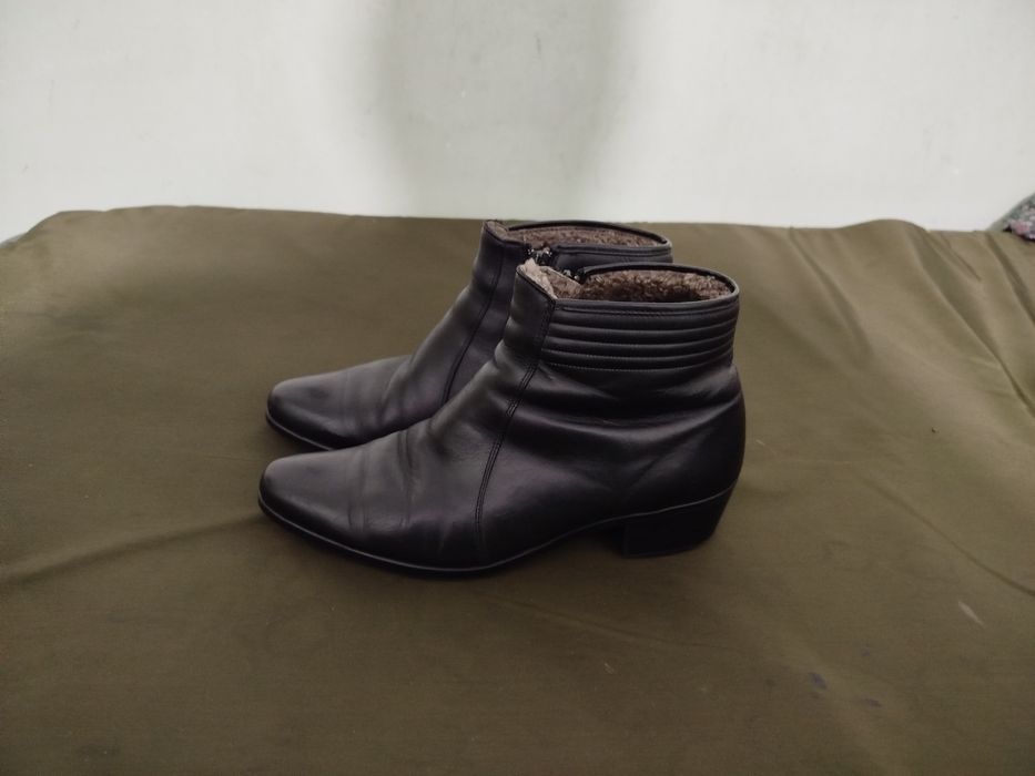 Продам фирменные сапоги.