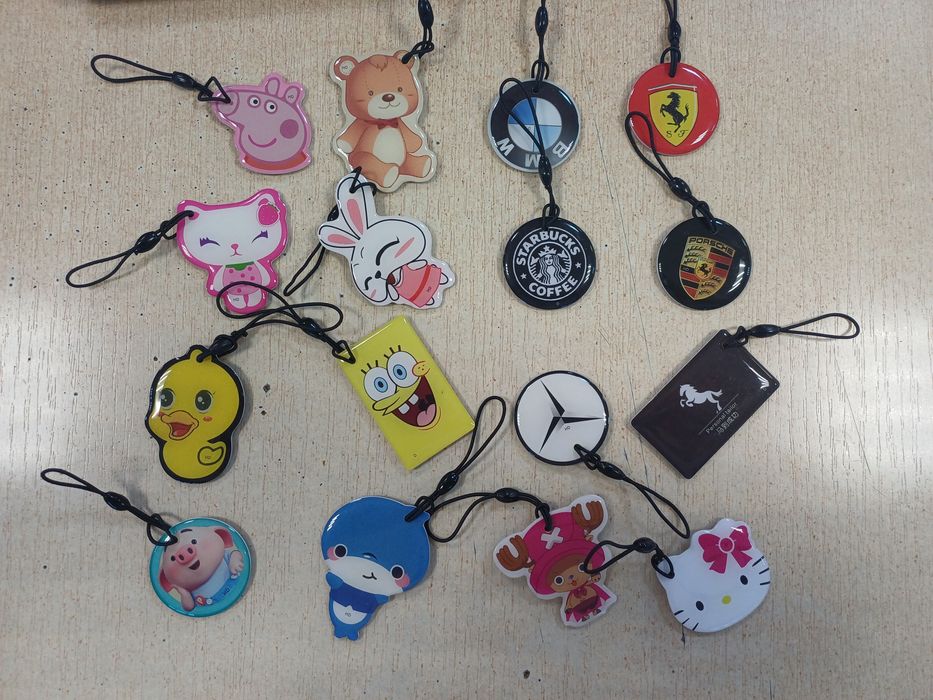 Домофонные ключи брелки и наклейки