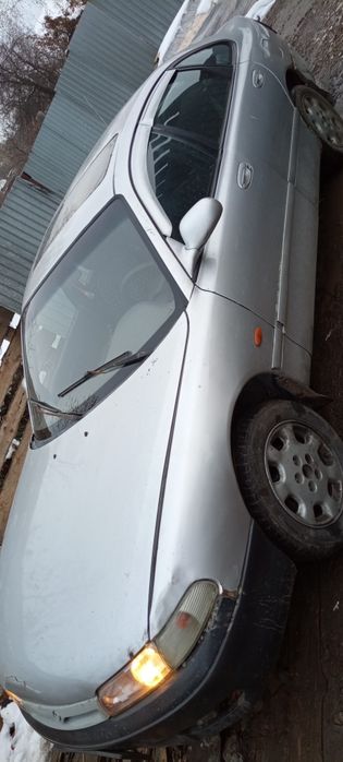 Мазда 626 Кронос на ходу