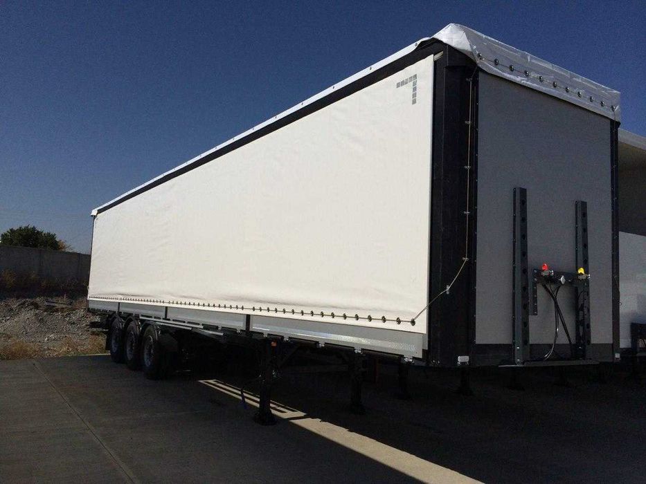 Полуприцеп шторный бортовой UzAutoTrailer - 92 куб