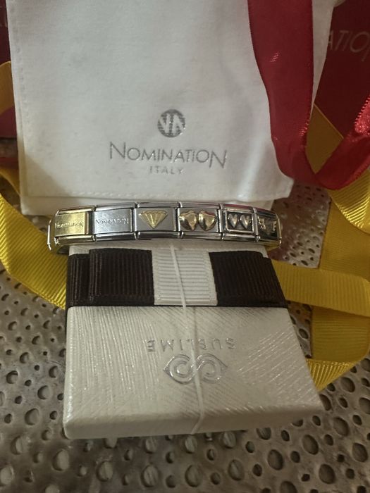 Гривна на Nomination