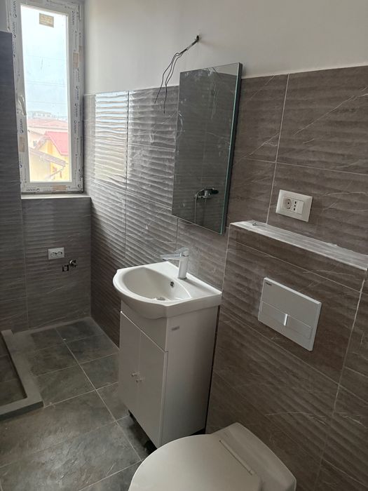 Vand garsoniera cu loc de parcare