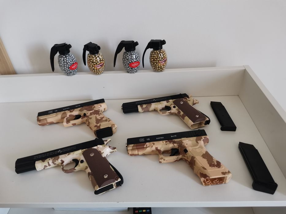 Pistol cu bile Glock Airsoft 6mm, bile plastic abs incluse 500buc, propulsie arc