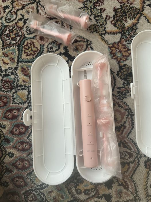 Электрическая зубная щетка