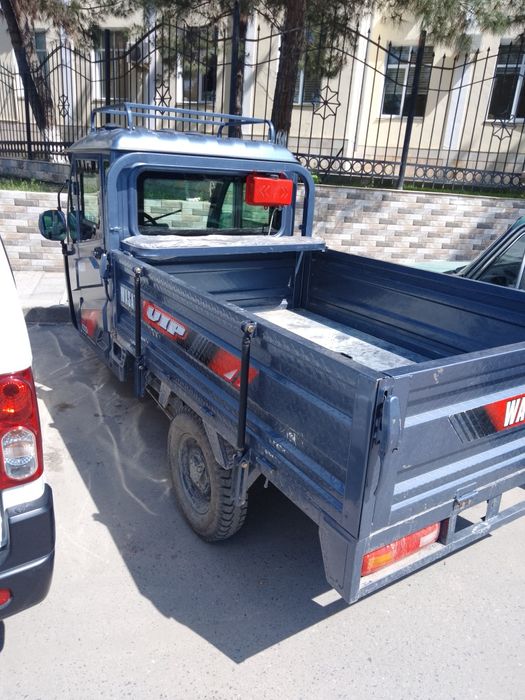 Skuter, gebrit matori, ham zaryadka bilan ham benzin bilan yuradi!