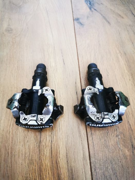 Lanț  11 viteze KMC X11, Pipă 9 cm Merida Expert, Pedale spd Shimano PD M520, Șa Merida/Bontrager