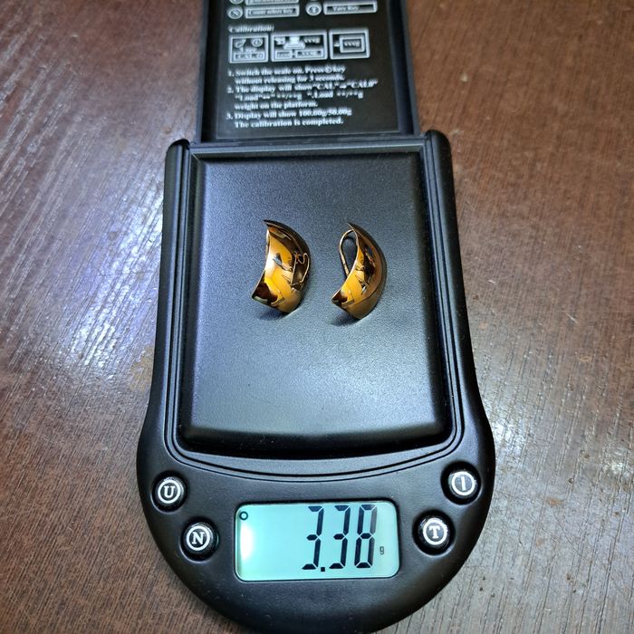 Продам золотые серьги