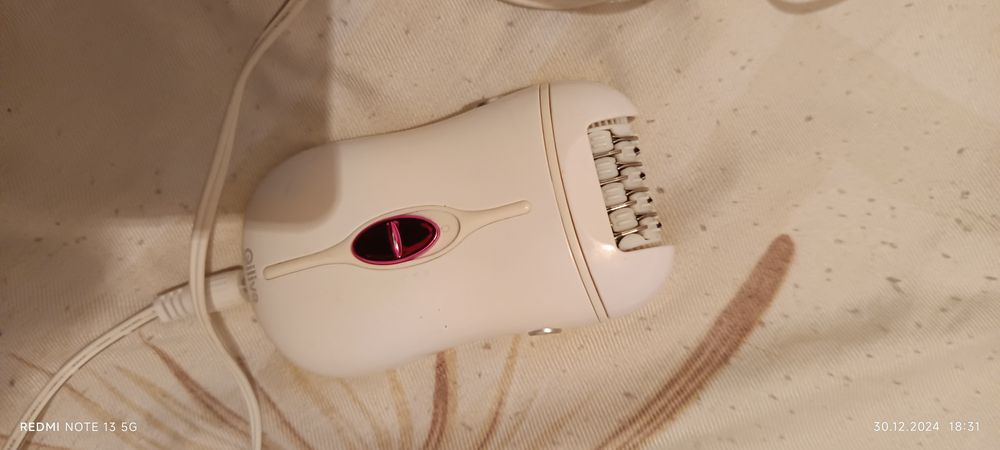 Epilator Philips și Qlive negru și alb