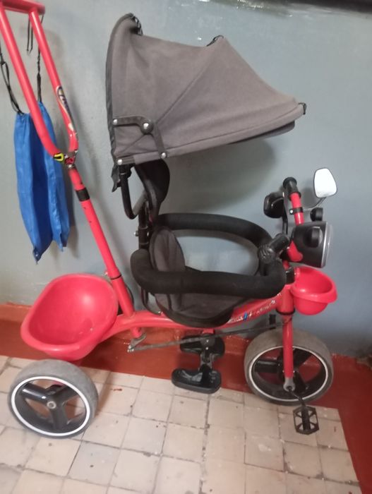 Велосипед с ручкой и музыкой