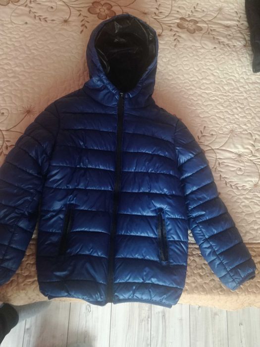 Продавам светло синьо детско зимно яке-DONG