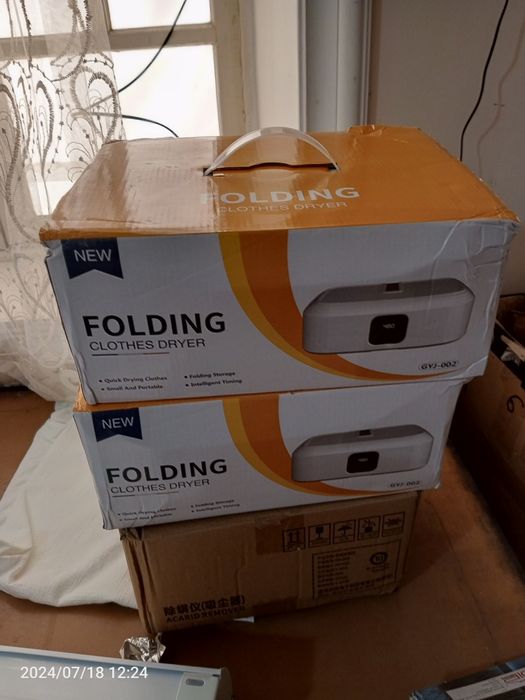 Kiyimni quritib hamda dazmollab beradigan apparat xitoyniki