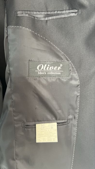 Продам костюм серого цвета