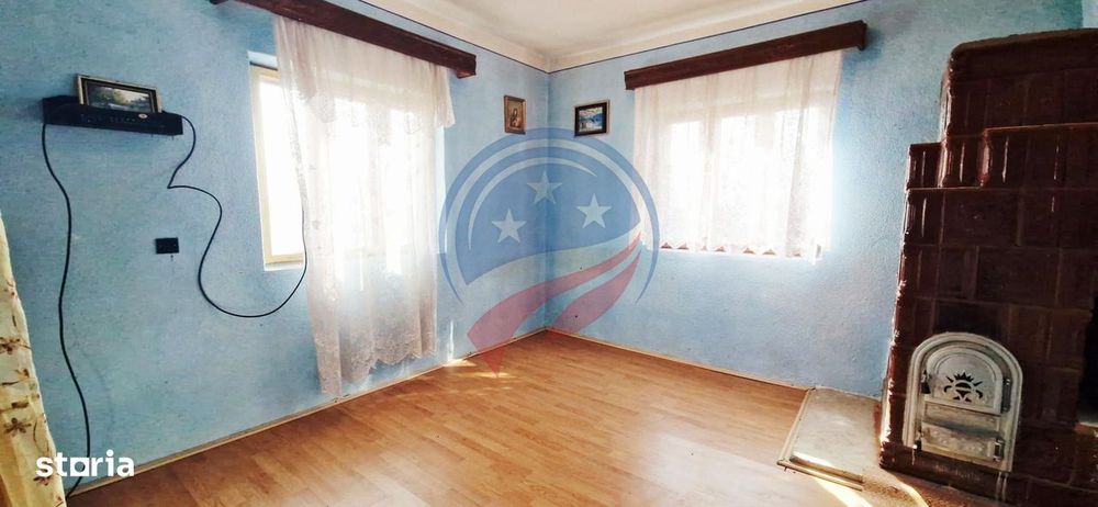 Casa Bradesti  teren  intravilan 7952 mp  deschidere 33 m la DE 70