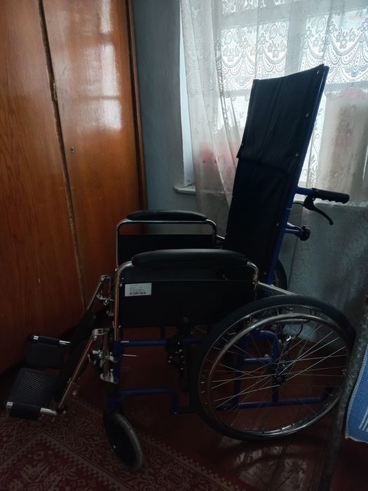 Инвалидная коляска.