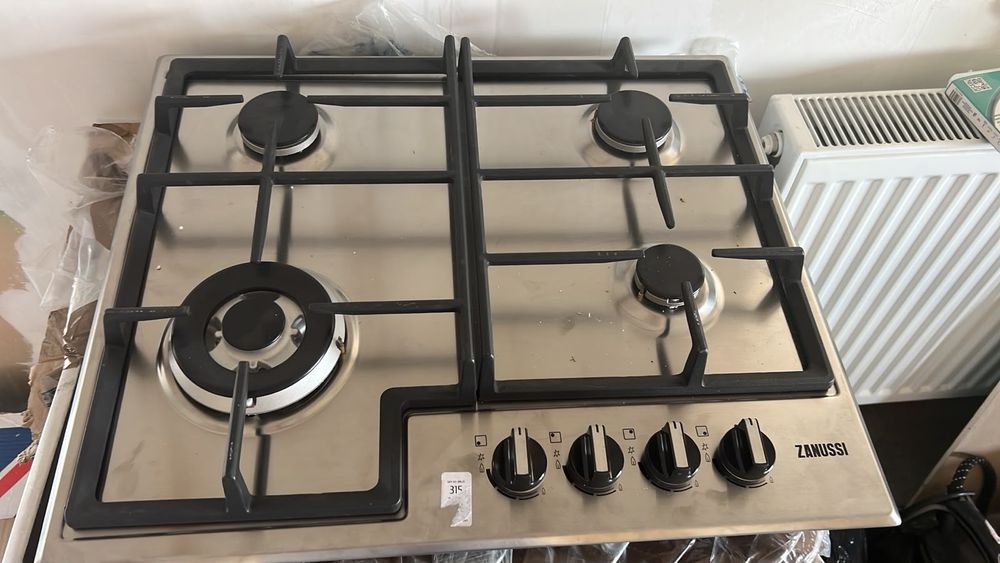 Plita incorporabila Zanussi ZGH66414XS, Gaz, 4 zone de gatit, Aprindere electrica, Dispozitiv sigura
