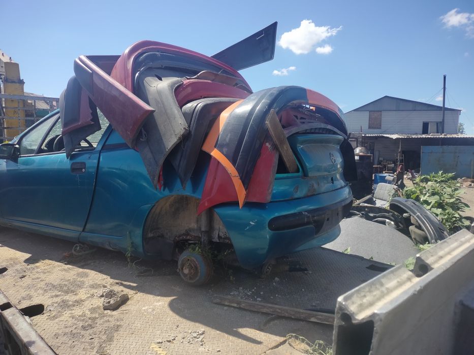 Опель тигра по запчастям