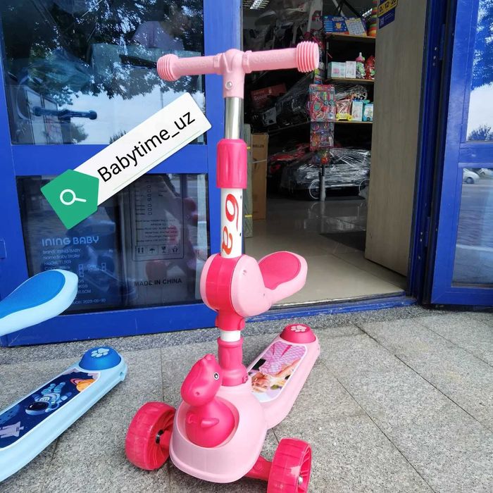 Новый детский самокат с динозавриком. Отличный подарок к празднику.