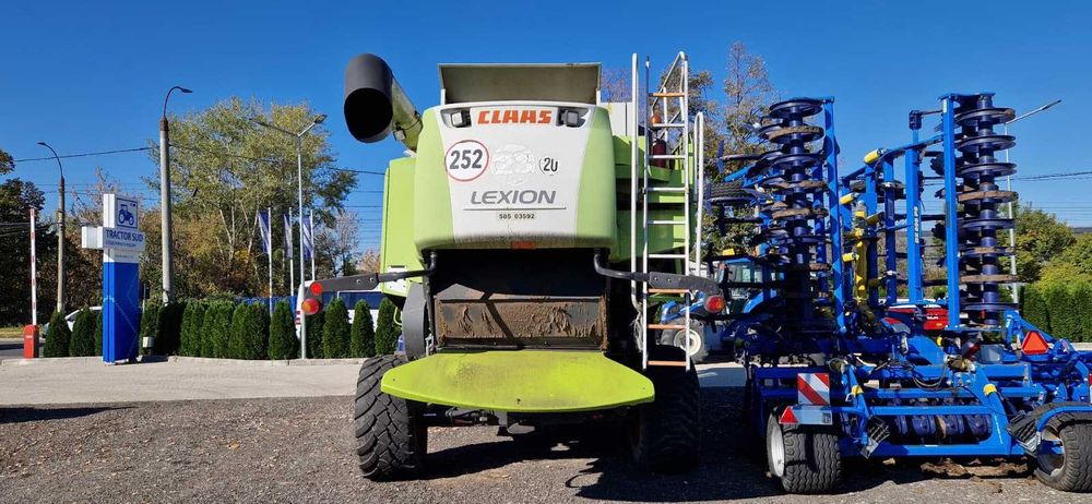 Combina CLAAS Lexion 570 + Heder Paioase 7,5m – 290 kW – An 2010
