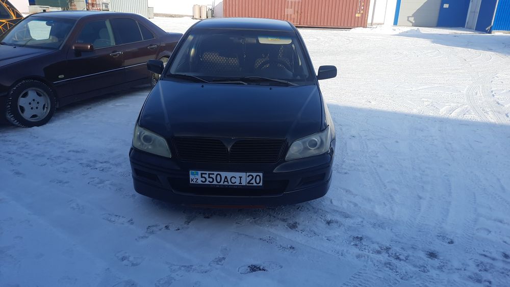 митсубиси лансер 2002