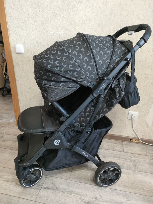 Продам прогулочную коляску NEW LUX "складывается чемоданчиком"