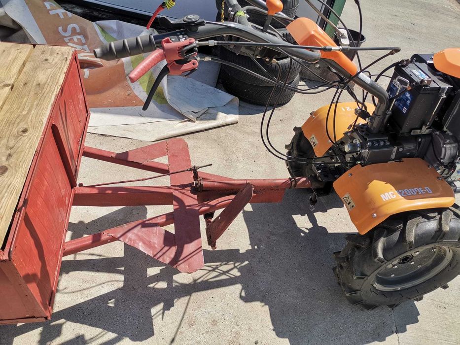 Motocultor O'MAC MC 12000E-D echipat cu remorca foarte incapatoare cu frana de picior